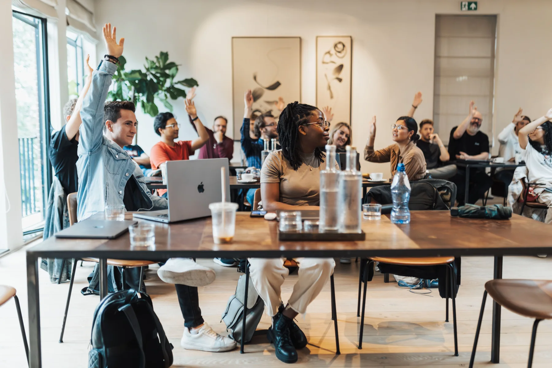 People taking part in a classroom discussion; an illustrative learning setting.